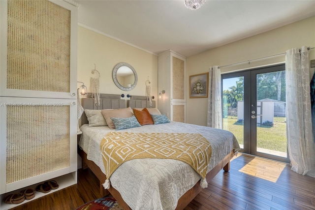 bedroom featuring access to exterior, crown molding, wood finished floors, and french doors