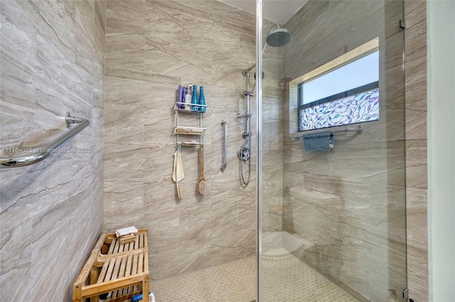 bathroom with tiled shower