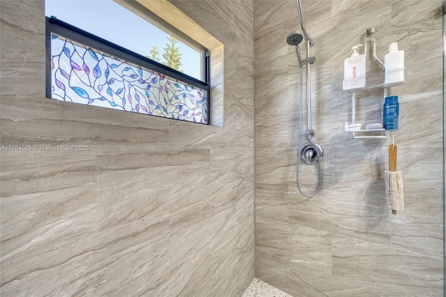 full bathroom with a tile shower