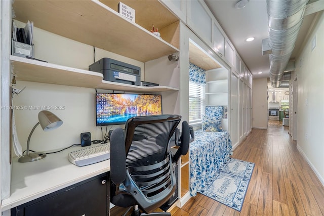 office area with light wood finished floors, recessed lighting, and baseboards