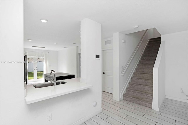 interior space featuring recessed lighting, visible vents, baseboards, and wood tiled floor