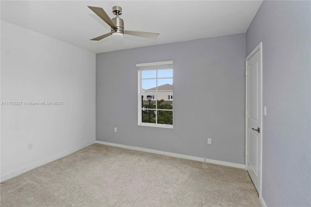 spare room with baseboards, ceiling fan, and carpet floors