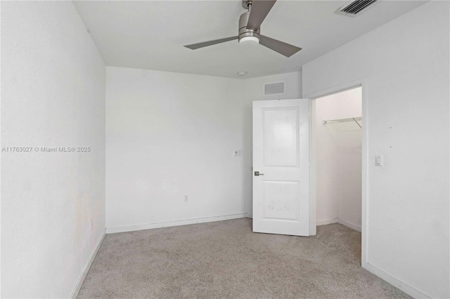 unfurnished bedroom with baseboards, visible vents, and carpet floors