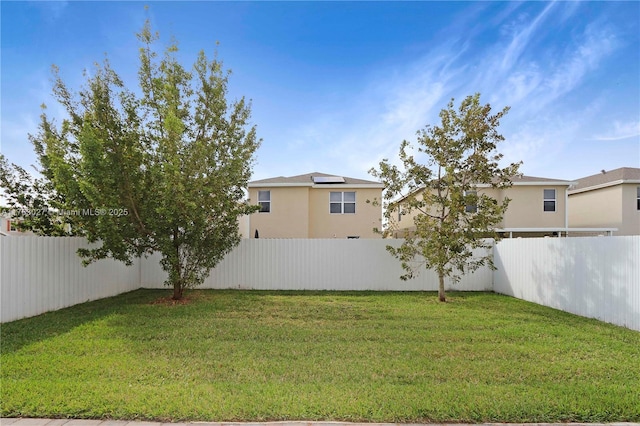 view of yard with a fenced backyard