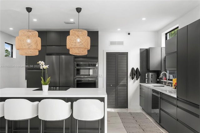 kitchen with visible vents, a sink, marble finish floor, stainless steel appliances, and modern cabinets