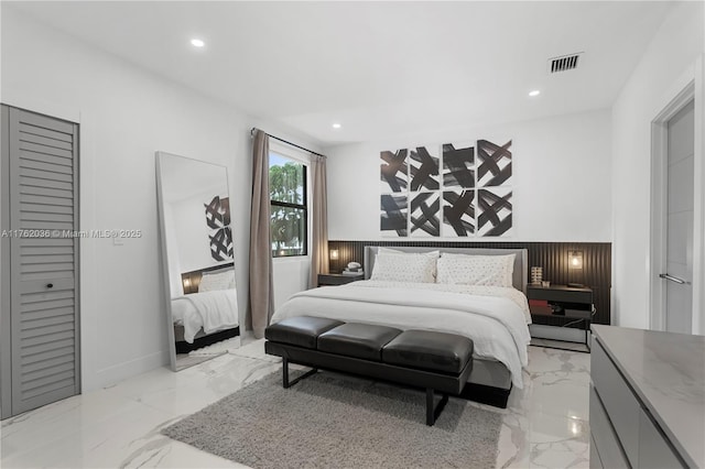 bedroom featuring recessed lighting, visible vents, and marble finish floor