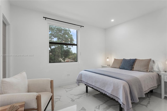 bedroom featuring recessed lighting, marble finish floor, and baseboards