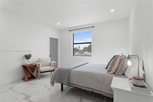 bedroom featuring recessed lighting, marble finish floor, and baseboards