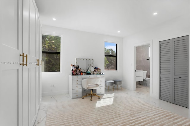 home office with recessed lighting, marble finish floor, and baseboards