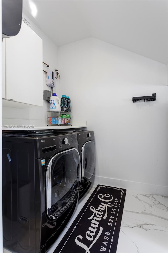 laundry room featuring cabinet space, independent washer and dryer, marble finish floor, and baseboards