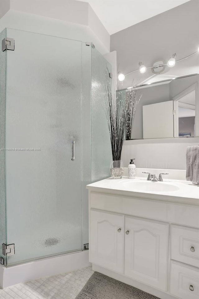 bathroom with vanity and a shower stall