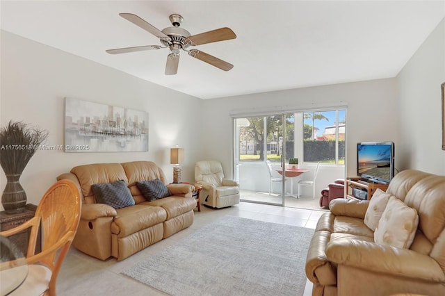 living room featuring light tile patterned floors and a ceiling fan