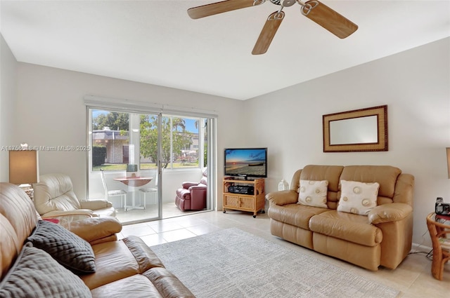 living area featuring light tile patterned floors and ceiling fan