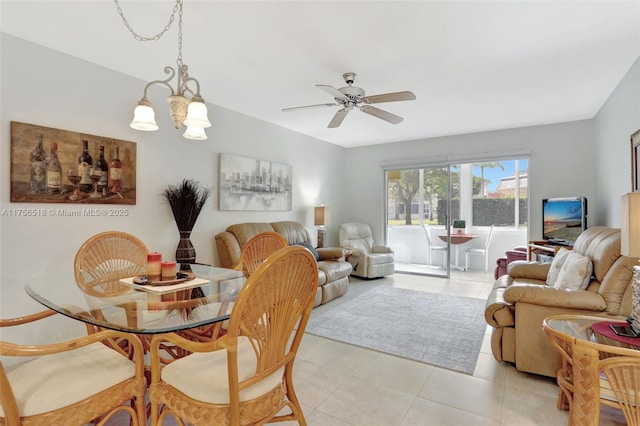 dining area with light tile patterned floors and ceiling fan