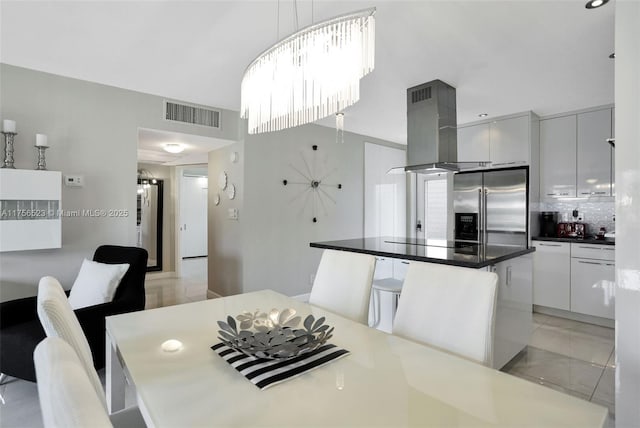 dining room featuring visible vents