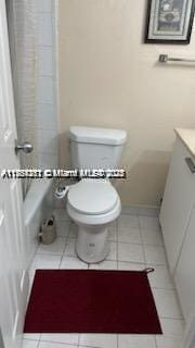 bathroom with vanity, tile patterned floors, and toilet