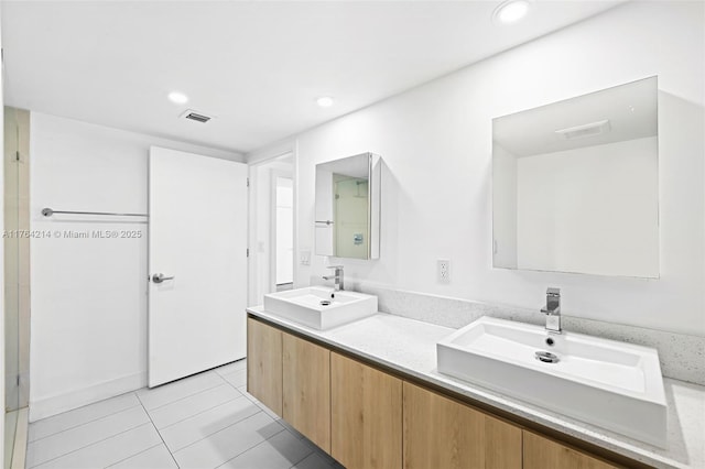 full bathroom featuring a sink, visible vents, recessed lighting, and tile patterned floors