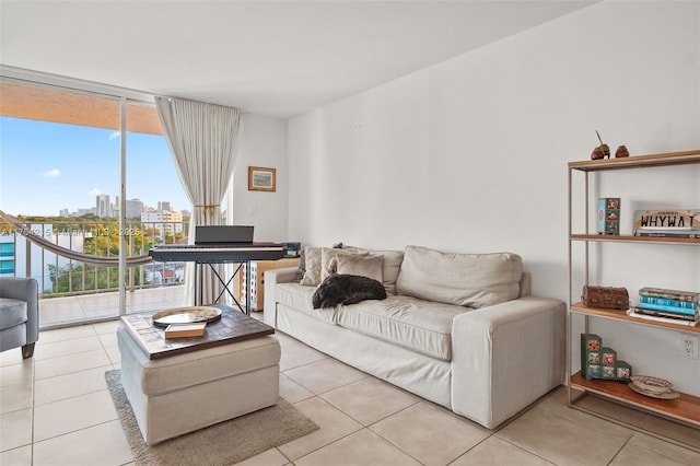 tiled living area featuring a city view and floor to ceiling windows