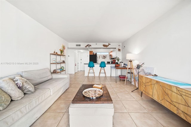 living room with visible vents and light tile patterned flooring