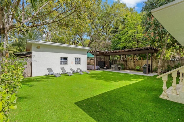 view of yard with a fenced backyard, a patio area, and a pergola