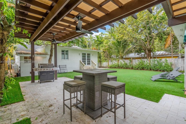 view of patio / terrace featuring french doors, a fenced backyard, and a pergola