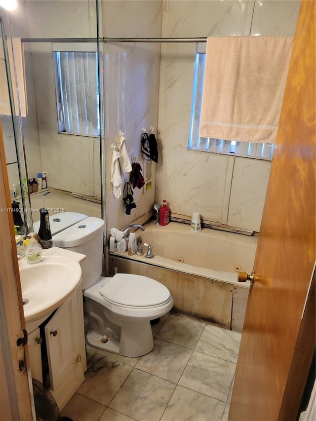 bathroom featuring shower / washtub combination, toilet, and vanity