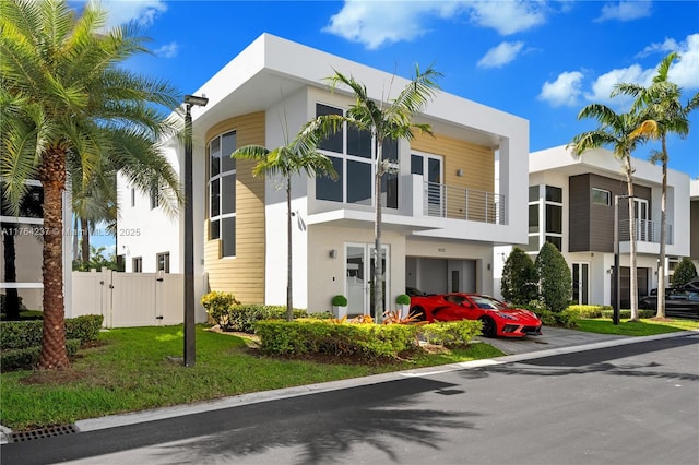 view of building exterior featuring a garage and fence