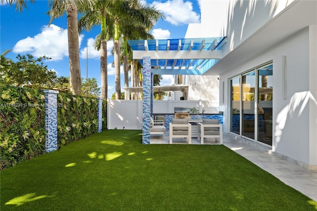 view of yard with a patio area and a fenced backyard