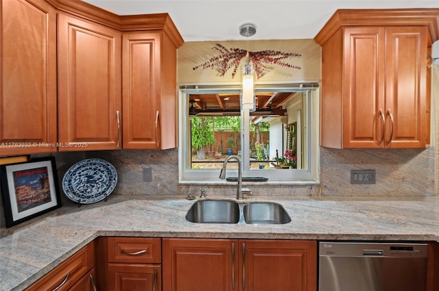 kitchen with stainless steel dishwasher, decorative backsplash, light stone counters, and a sink