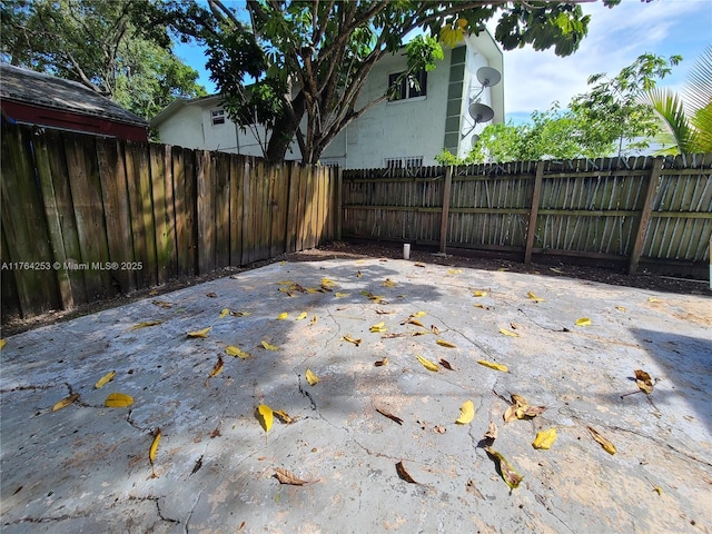 view of patio / terrace featuring fence