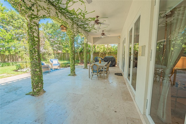 view of patio / terrace featuring a fenced backyard and a ceiling fan