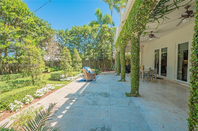 view of patio / terrace featuring a fenced backyard and ceiling fan