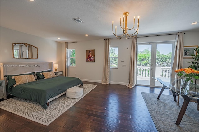 bedroom featuring visible vents, baseboards, dark wood-style flooring, access to outside, and a notable chandelier