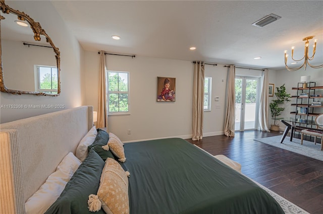 bedroom featuring visible vents, an inviting chandelier, recessed lighting, dark wood-style flooring, and access to exterior