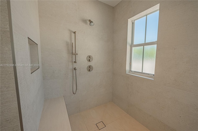 full bathroom with tiled shower