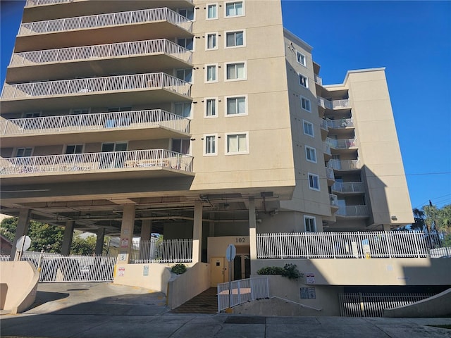 view of property with fence