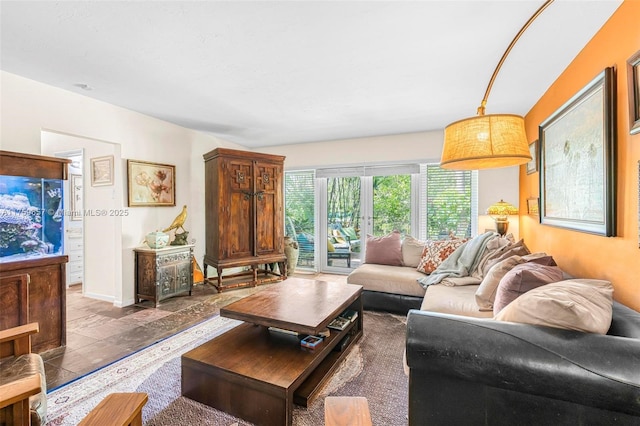 living area featuring baseboards