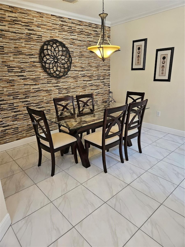 dining area featuring visible vents, marble finish floor, crown molding, and baseboards