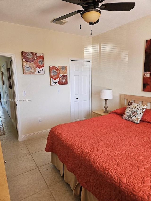 bedroom with light tile patterned floors, visible vents, ceiling fan, and baseboards