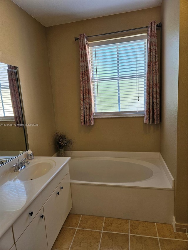 full bathroom with a bath, plenty of natural light, and vanity