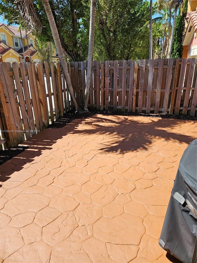 view of patio / terrace featuring fence