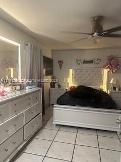 bedroom featuring light tile patterned floors and a ceiling fan