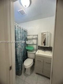 full bath with visible vents, curtained shower, toilet, tile patterned floors, and vanity