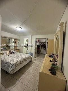 bedroom with light tile patterned floors