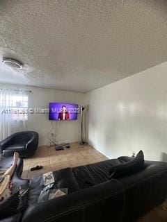 living area with a textured ceiling