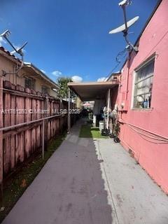 view of property exterior with fence