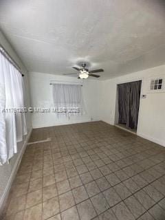 empty room with a ceiling fan