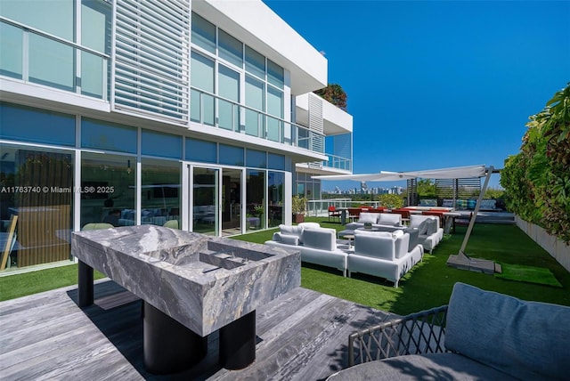 4701 N Meridian Ave Unit 603, Miami Beach, FL 33140 - deck featuring an outdoor living space and a lawn