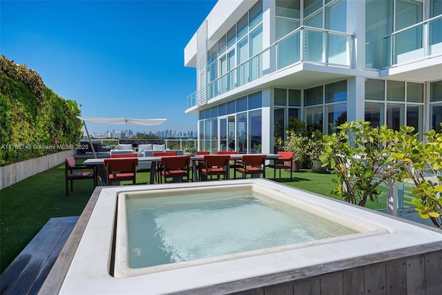 4701 N Meridian Ave Unit 603, Miami Beach, FL 33140 - view of swimming pool with outdoor dining area and a yard