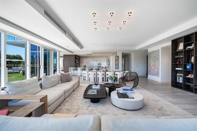 4701 N Meridian Ave Unit 603, Miami Beach, FL 33140 - living room featuring visible vents and baseboards